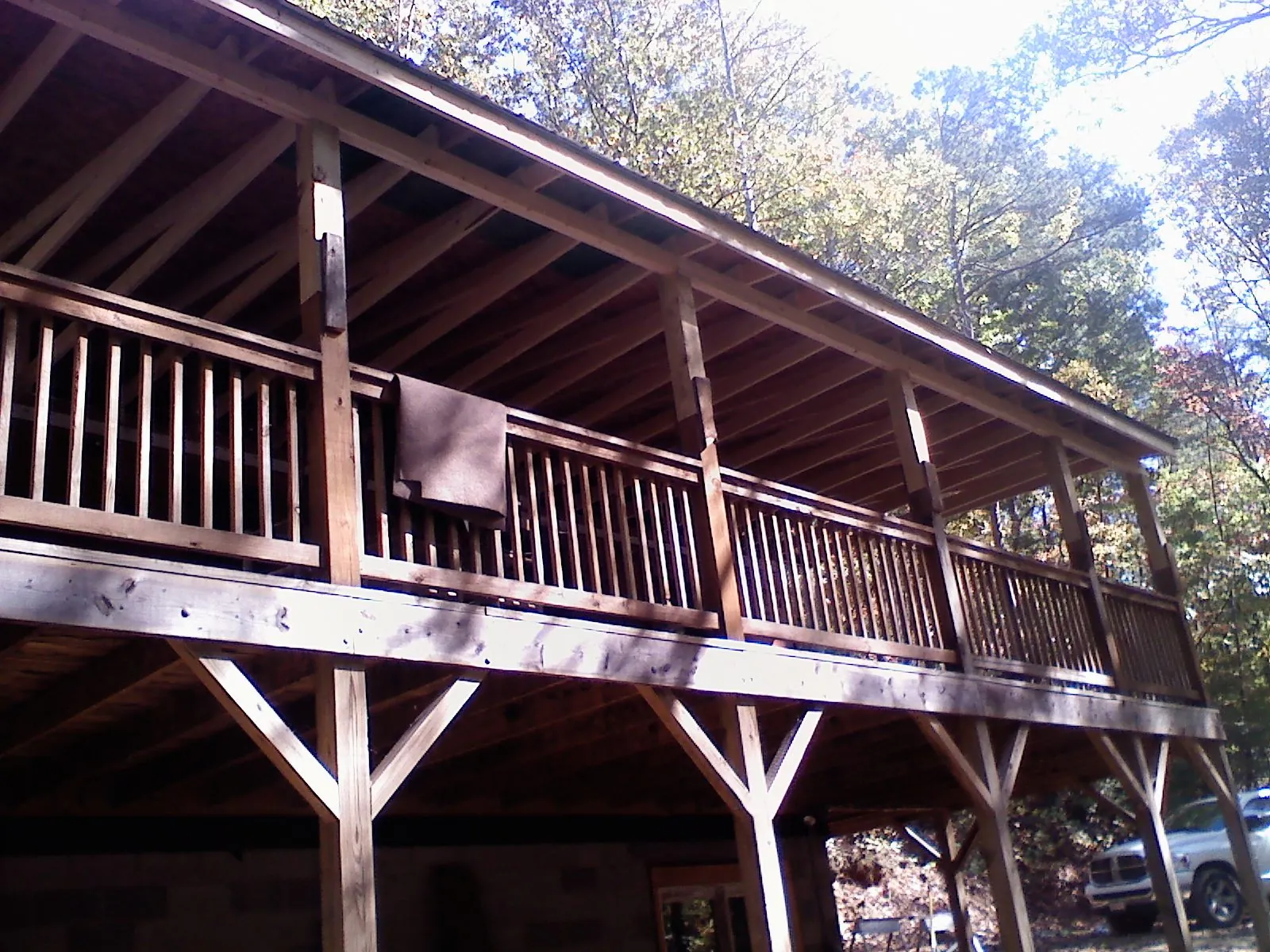 Timber framing under a new elevated porch and deck — Roof Leak Repair in North Providence by Roofing Brothers